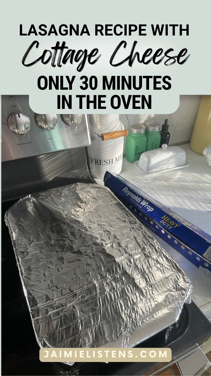Glass baking dish covered with foil before baking homemade lasagna recipe with cottage cheese.