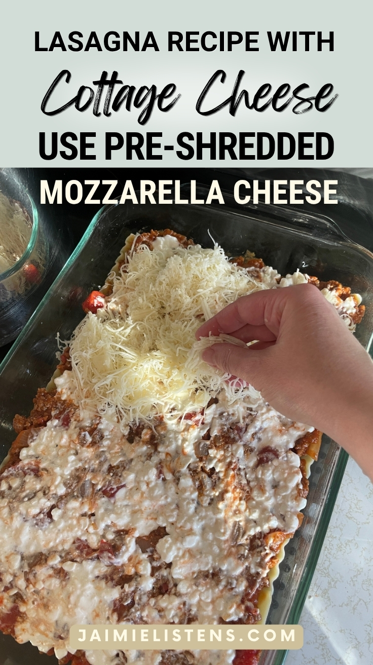 Hand sprinkling shredded mozzarella cheese over homemade lasagna recipe with cottage cheese before baking.
