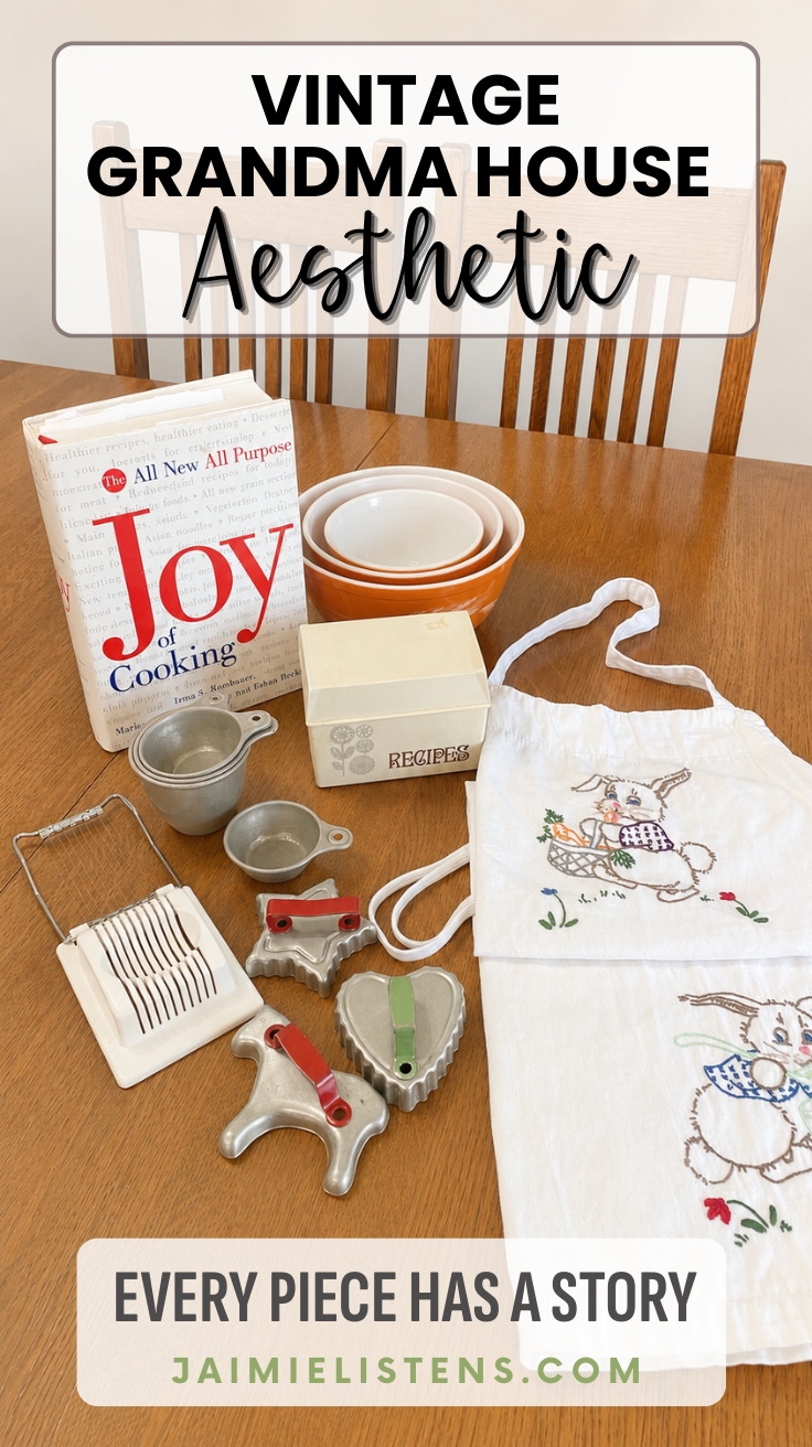 Vintage Joy of Cooking cookbook, recipe box, Pyrex nesting bowls, embroidered bunny apron, and antique kitchen tools displayed on a wooden table. Pin text reads: Every Piece Has A Story.