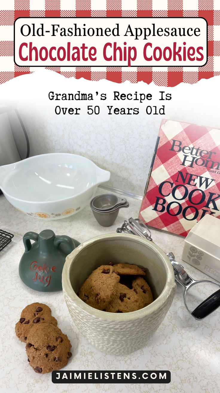 Vintage-inspired display of old-fashioned applesauce chocolate chip cookies with a cookie jar, measuring cups, and classic cookbook.