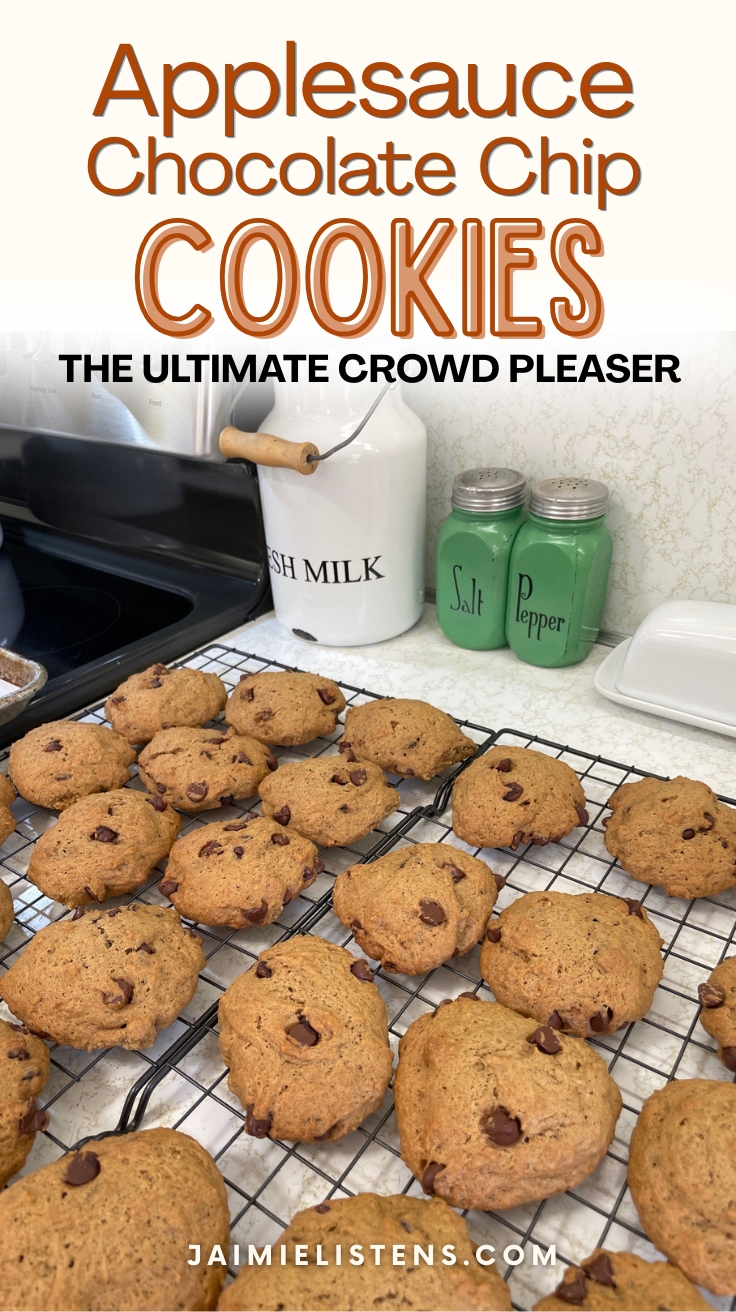 Cooling racks filled with freshly baked applesauce chocolate chip cookies in a vintage-style kitchen setting.
