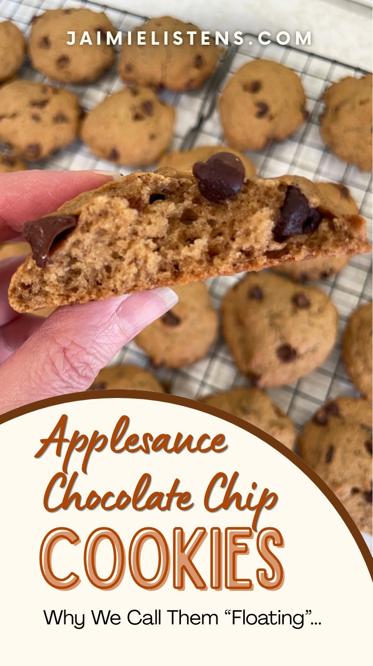 Close-up of a soft applesauce chocolate chip cookie broken in half to show the fluffy interior texture with chocolate chips throughout.