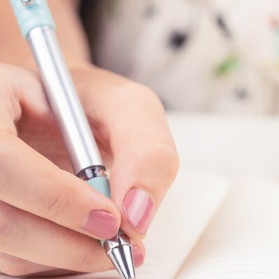 Important documents checklist being written down in a notebook.