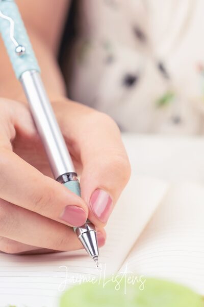 Important documents checklist being written down in a notebook.